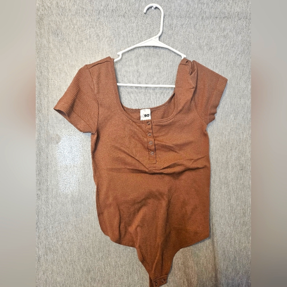 Medium sized brown body suit tight fitted